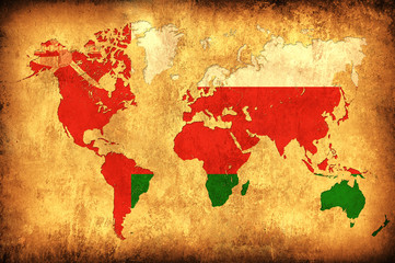 The flag of Oman in the outline of the world map