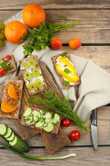 Still life with vegetarian sandwiches on wooden table