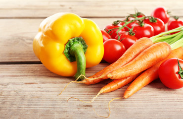 Fresh vegetables on wooden table, closeup