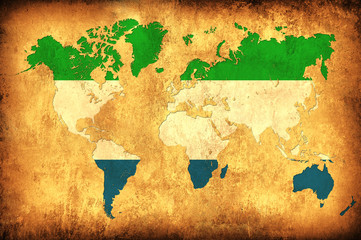The flag of Sierra Leone in the outline of the world map