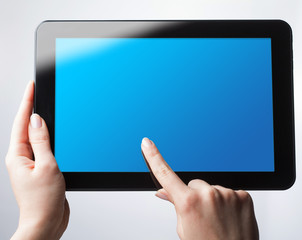tablet pc with a blank screen in the hands. Business, technology