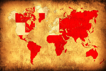 The flag of Tonga in the outline of the world map