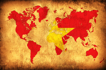 The flag of Vietnam in the outline of the world map