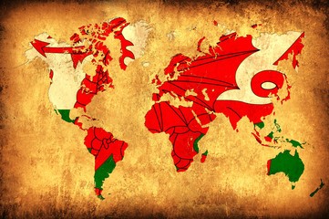 The flag of Wales in the outline of the world map