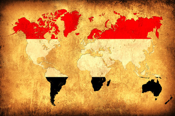 The flag of Yemen in the outline of the world map