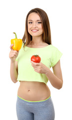 Healthy young woman with pepper and tomato isolated on white