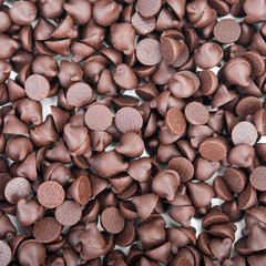 Chocolate chips that are laid in the background