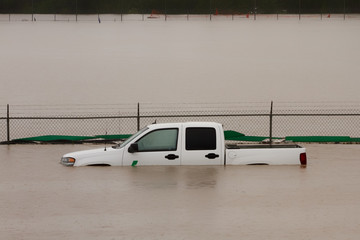 White truck submerged in flood water during the 2013 Calgary flood.