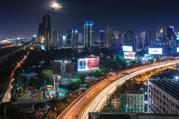 Obraz na płótnie Canvas Business Building Bangkok city area at night life with transport