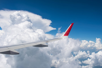 Fototapeta na wymiar Wing of an airplane flying