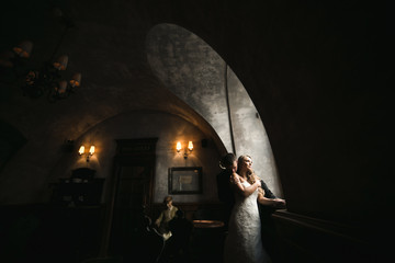 The bride and groom in a cozy house