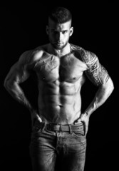 Fototapeta na wymiar Muscular man - half-length, black and white photo