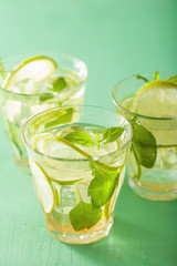 fresh mojito cocktail over green background