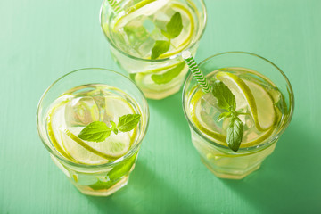 fresh mojito cocktail over green background