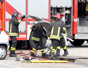 fireman in action during a car accident