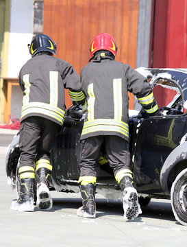 firefighters in action during a road accident