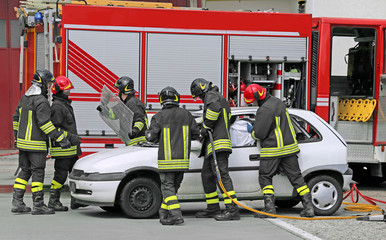brave firefighters relieve an injured after a road accident