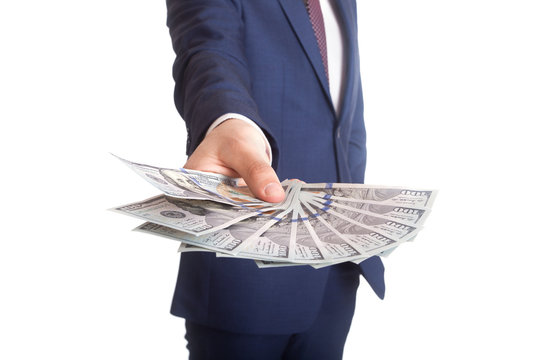 Business man Displaying a Spread of Dollar
