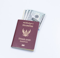 Thai passport book with dollar banknote