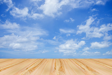 Wooden floor with blue sky background
