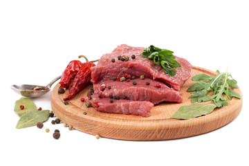 Meat on a cutting board isolated on white background.
