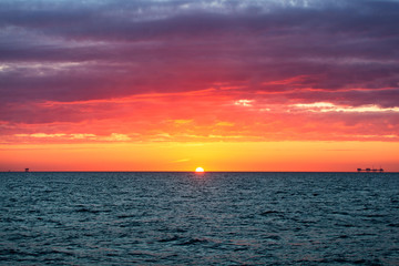 Oil platform in sunrise time