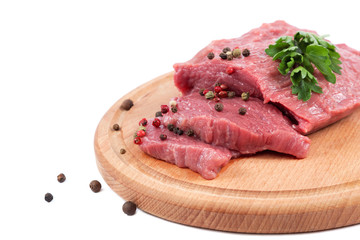 Meat on a cutting board isolated on white background.