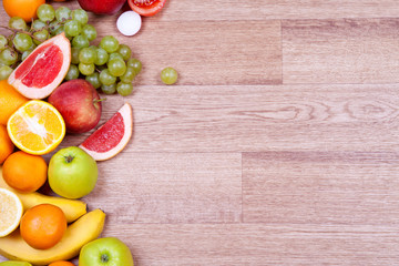 Juicy ripe fruit on a wooden background