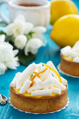 Tartlets with lemon cream and meringue. Lemon pie.