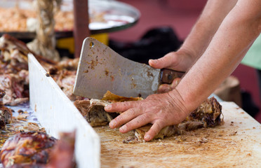 Butcher chopping ribs