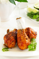 Roasted chicken legs with barbecue sauce with mango chutney.
