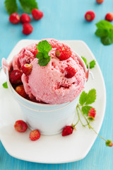 Homemade ice cream with wild strawberry.