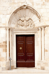 Entrance to the church of Assumption of the Blessed Virgin Mary in Pag, Croatia