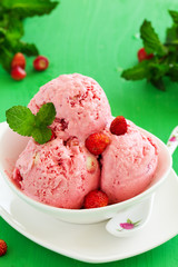 Homemade ice cream with wild strawberry.