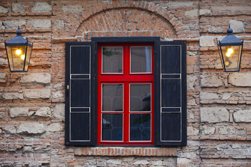 facade of the building ,  window a red- black