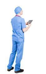 Back view of doctor in robe holding tablet computer