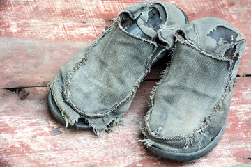 old canvas shoes on wood background