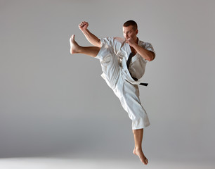 Man in white kimono training karate © master1305