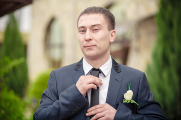 stylish bride to tie a tie