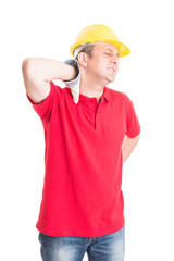 Tired construction worker feeling neck pain