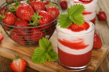 Dessert with strawberry jelly and whipped cream