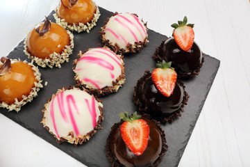 Tray with delicious catering cakes
