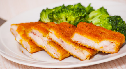 fried breaded fish fillets with broccoli