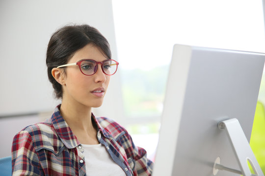 Portrait of office worker with eyeglasses on