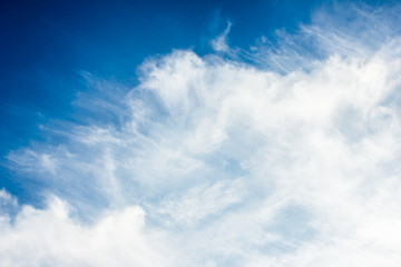 Naklejka na ściany i meble Blue cloudy sky texture.
