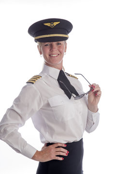 Portrait of an attractive mid age female senior airline pilot