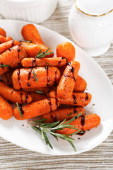 Baked small carrot on a plate