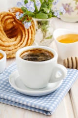 Obraz na płótnie Canvas Cup of coffee on the breakfast table