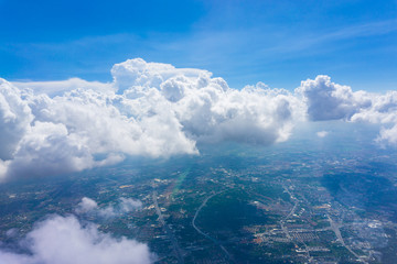 Modern building in city at day with blue sky and white cloud