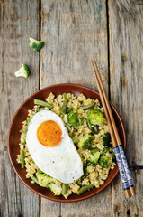 stir fried millet with broccoli, green beans and fried egg